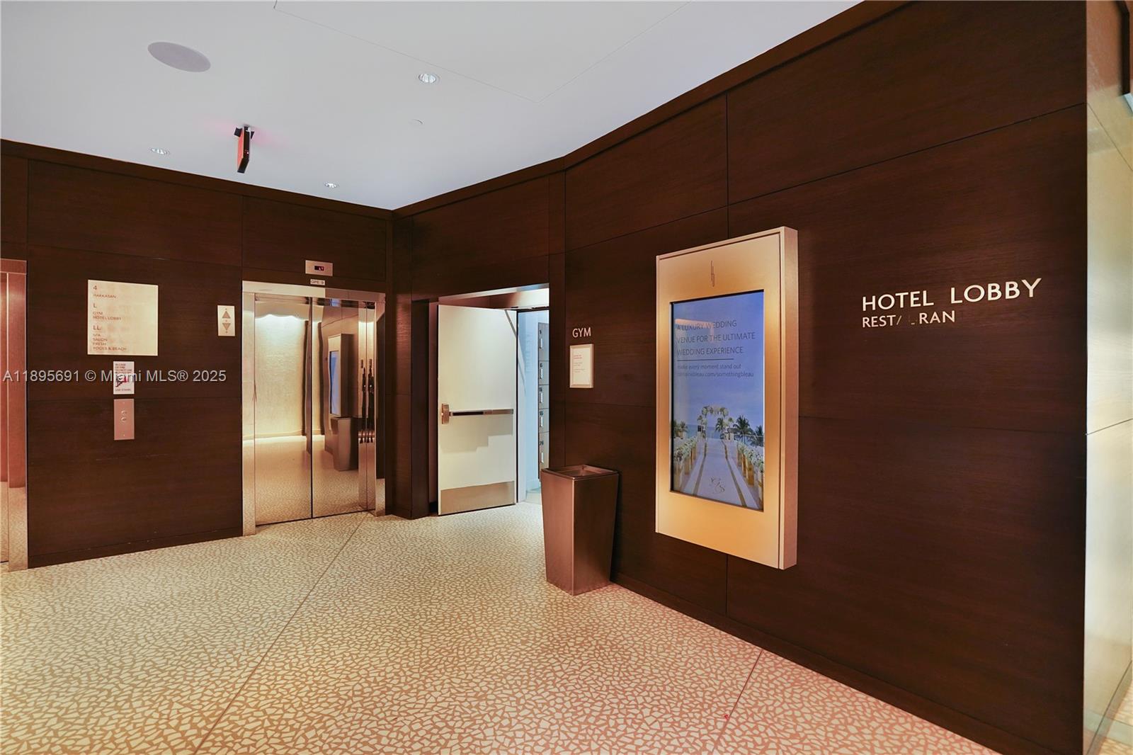 4401 Collins Avenue, Unit 2011 Miami Beach, FL 33140 - Photo 59 of 64 a bedroom with a bed and window