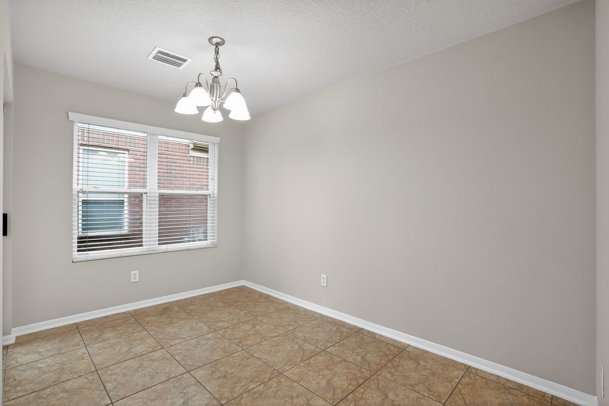 29414 Winton Wood Way Spring, TX 77386 - Photo 20 of 35 an empty room with chandelier fan