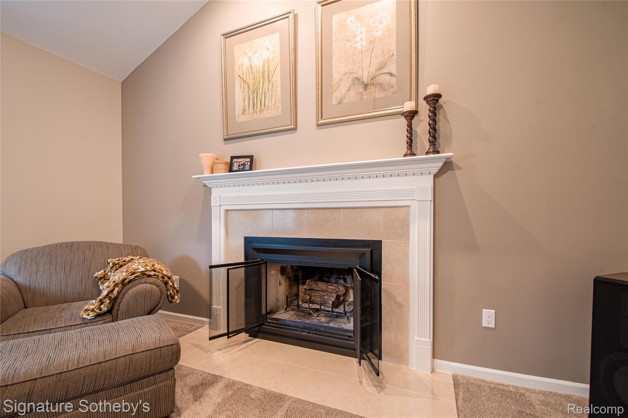 745 West Ridge Court Lake Orion, MI 48359 - Photo 18 of 44 Wood burning fireplace in great room