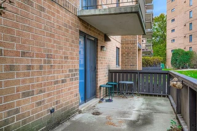 a view of a balcony with furniture