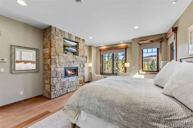 a bed room with a bed and a fireplace