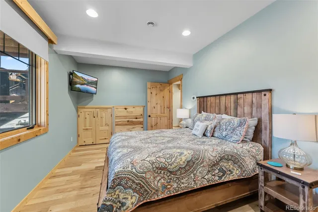 a bedroom with a bed and dresser