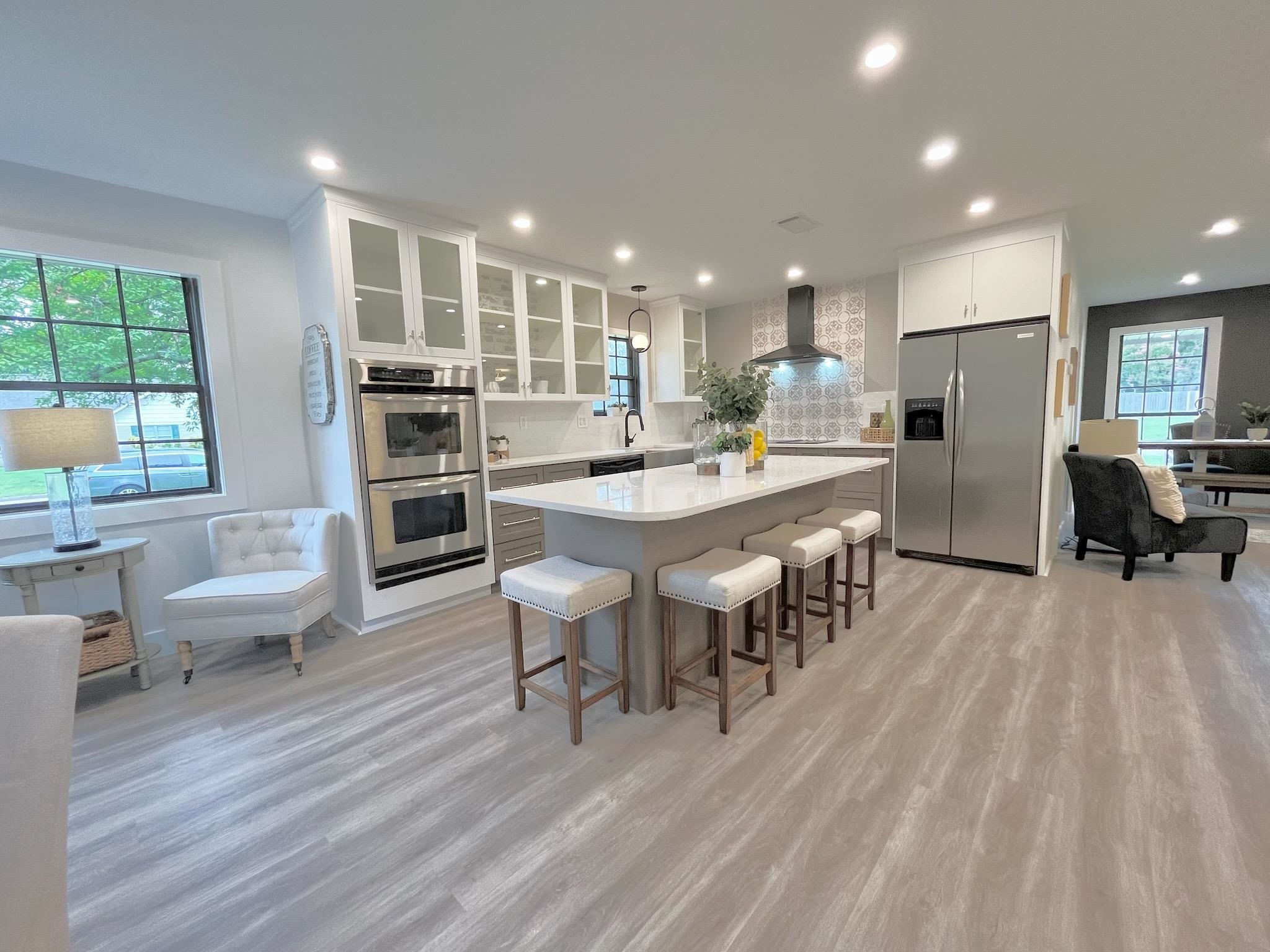 2138 Sonning Drive Germantown, TN 38138 - Photo 11 of 40 a large kitchen with dining room and wooden floor