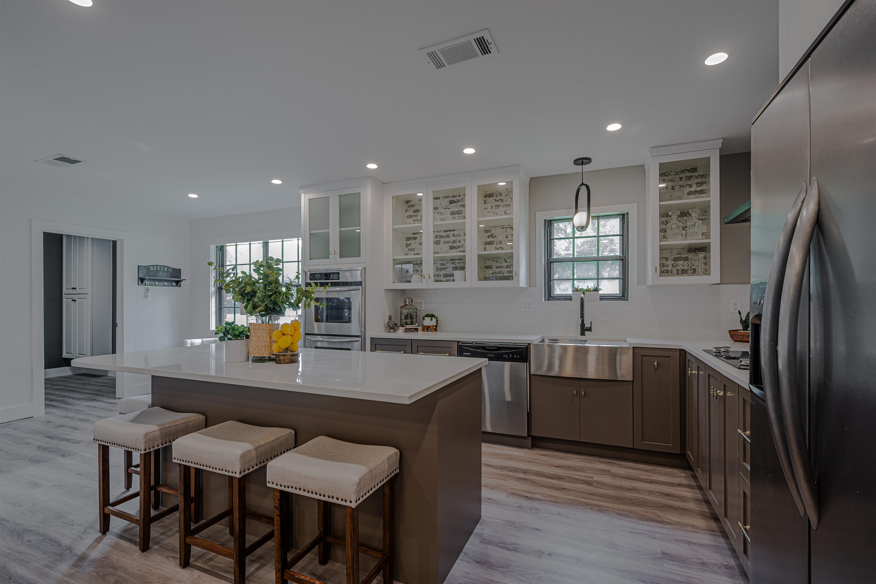 2138 Sonning Drive Germantown, TN 38138 - Photo 12 of 40 a kitchen with stainless steel appliances granite countertop a sink a stove a dining table and chairs