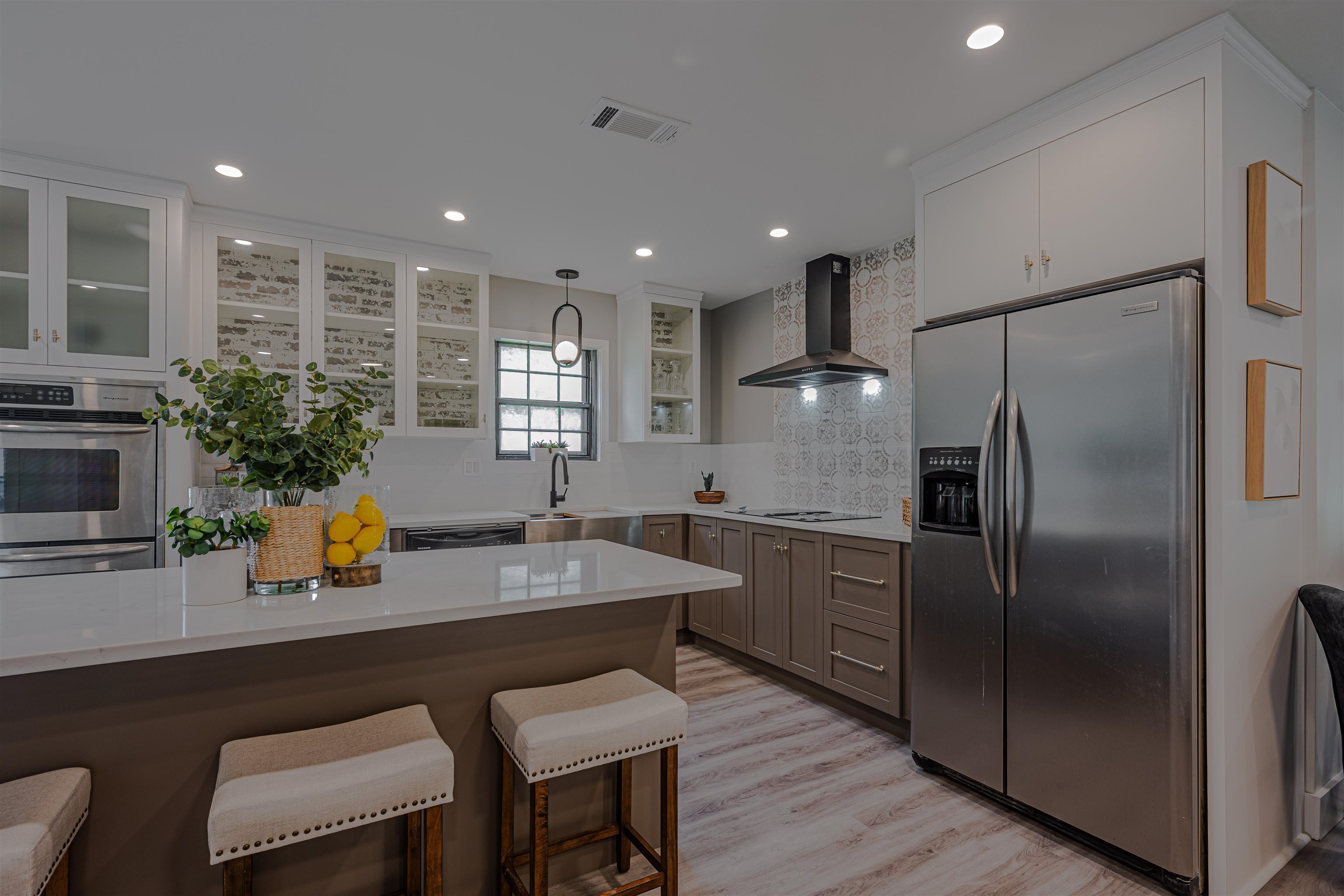 2138 Sonning Drive Germantown, TN 38138 - Photo 13 of 40 a kitchen with stainless steel appliances granite countertop a refrigerator a sink a stove a dining table and chairs