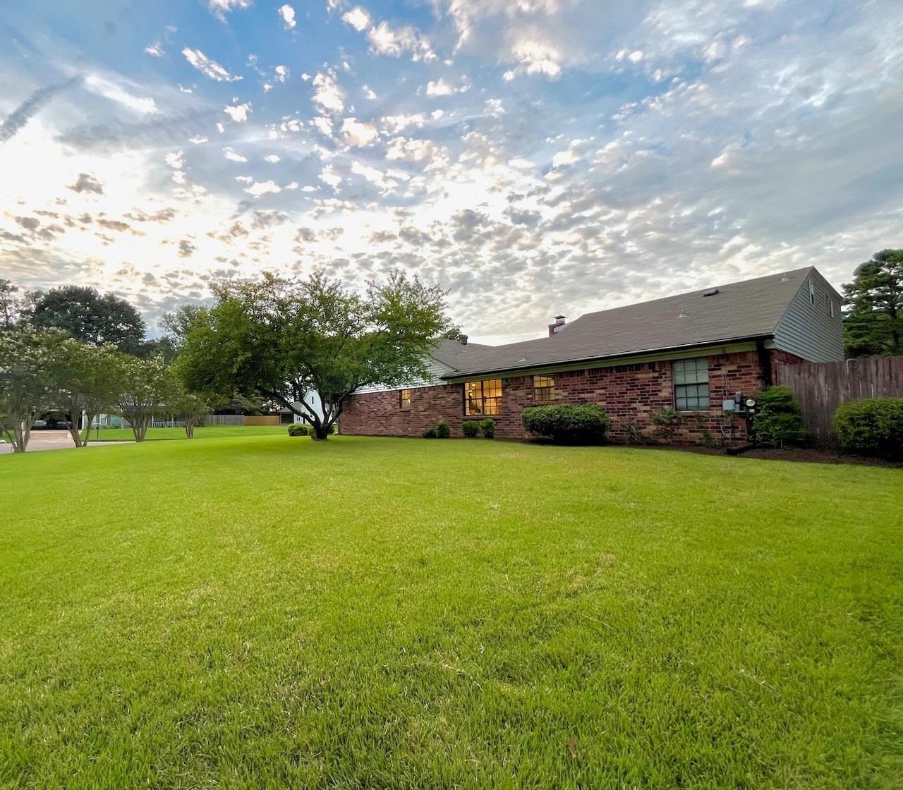 2138 Sonning Drive Germantown, TN 38138 - Photo 39 of 40 a view of a big yard with swimming pool and green space