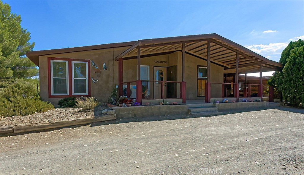 4237 Marco Road Phelan, CA 92371 - Photo 1 of 1 front view of a house with a porch