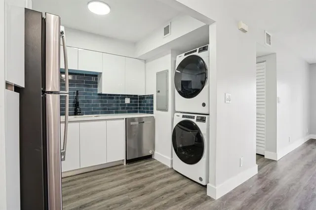 a kitchen with a washer and dryer