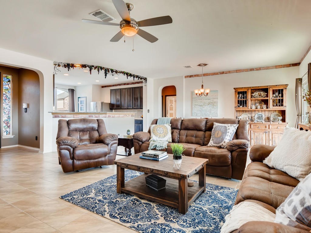 1301 Autumn Sage Way Pflugerville, TX 78660 - Photo 22 of 28 a living room with furniture a ceiling fan and a rug