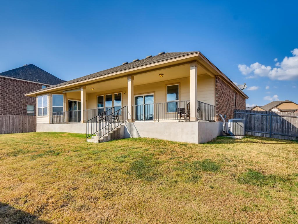 1301 Autumn Sage Way Pflugerville, TX 78660 - Photo 27 of 28 a view of a house with pool and a yard
