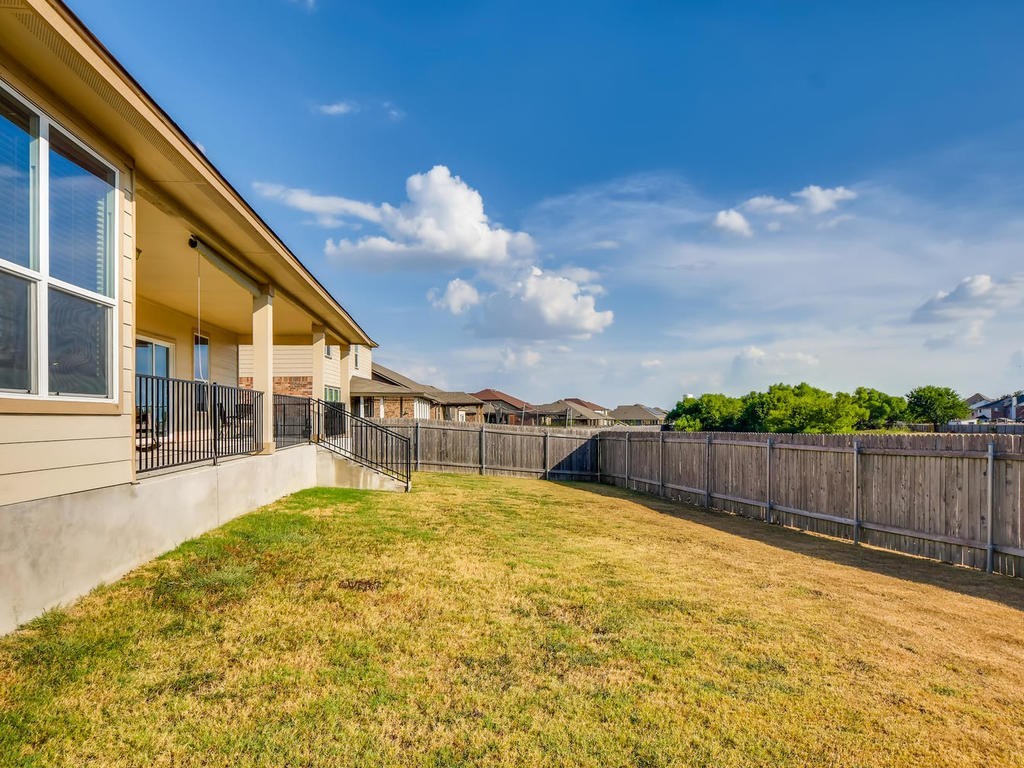 1301 Autumn Sage Way Pflugerville, TX 78660 - Photo 28 of 28 a view of swimming pool with seating area and small garden in the background