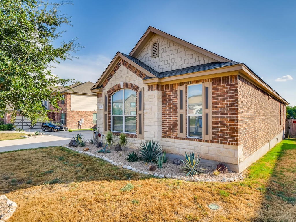1301 Autumn Sage Way Pflugerville, TX 78660 - Photo 3 of 28 a front view of a house with a yard