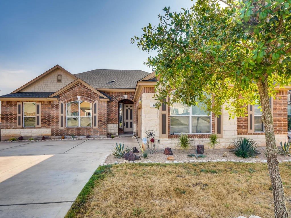 1301 Autumn Sage Way Pflugerville, TX 78660 - Photo 4 of 28 a front view of a house with garden