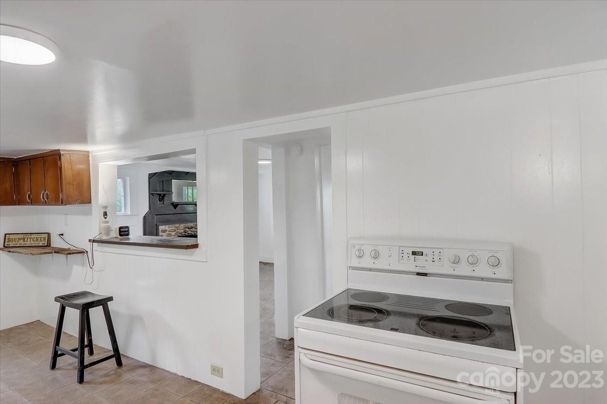 214 Plank Road Canton, NC 28716 - Photo 15 of 27 a kitchen with cabinets and appliances