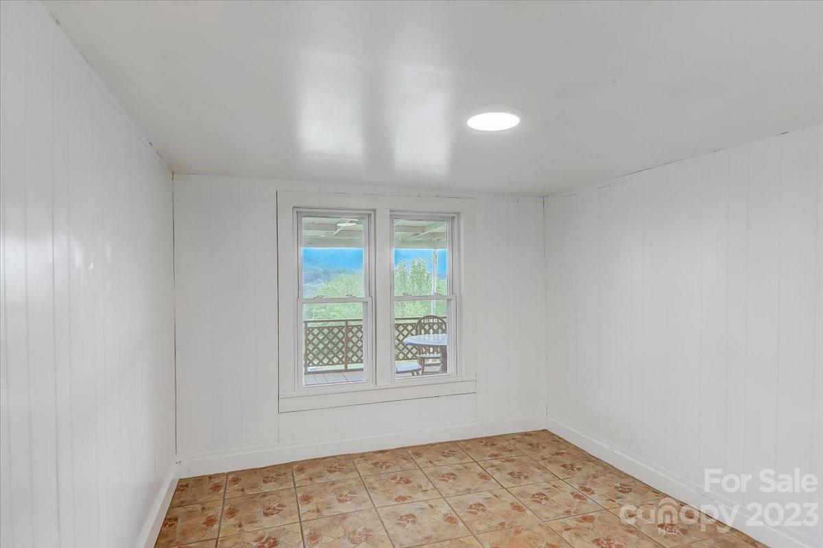 214 Plank Road Canton, NC 28716 - Photo 16 of 27 an empty room with a window