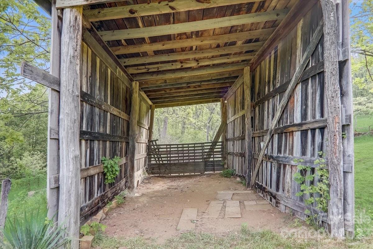 214 Plank Road Canton, NC 28716 - Photo 25 of 27 a view of entryway with wooden stairs and a yard