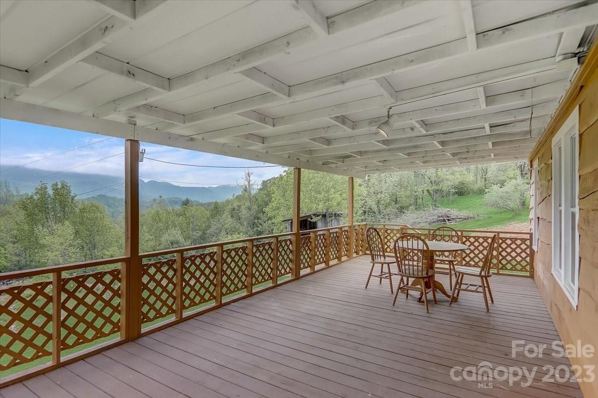 214 Plank Road Canton, NC 28716 - Photo 5 of 27 a view of a balcony with furniture and wooden floor