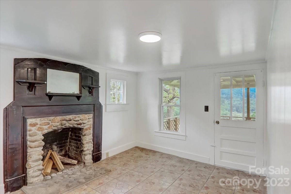 214 Plank Road Canton, NC 28716 - Photo 10 of 27 a view of a livingroom with a fireplace