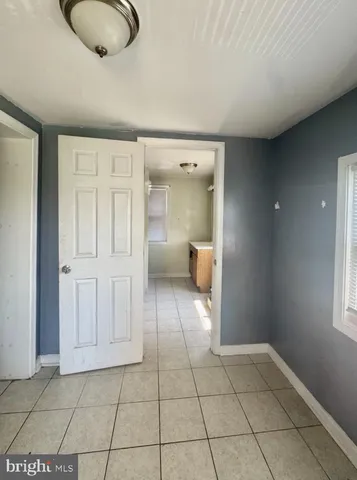 a view of empty room with a bathroom