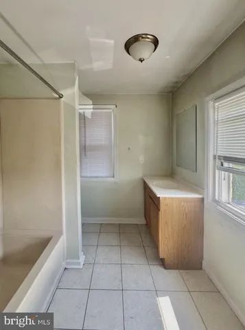 a room with a cabinets and window