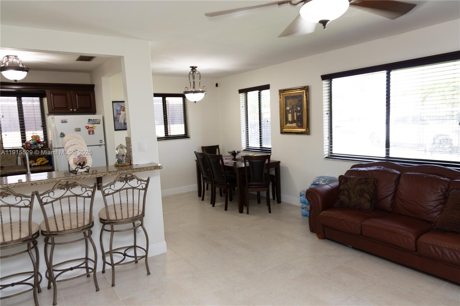 14280 Southwest 285th Street, Unit A Homestead, FL 33033 - Photo 15 of 18 a living room with furniture and a large window