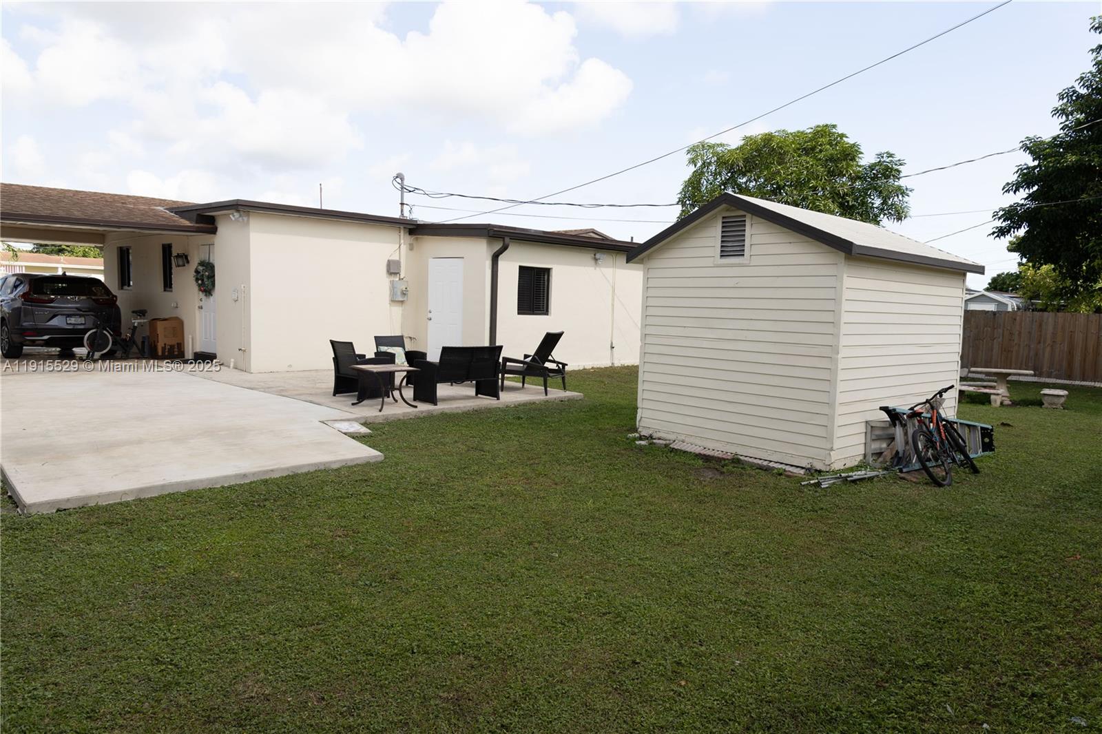 14280 Southwest 285th Street, Unit A Homestead, FL 33033 - Photo 4 of 18 a view of a house with backyard and sitting area