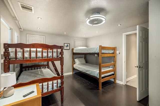 a bedroom with furniture and a window