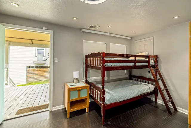 a bedroom with furniture and a window