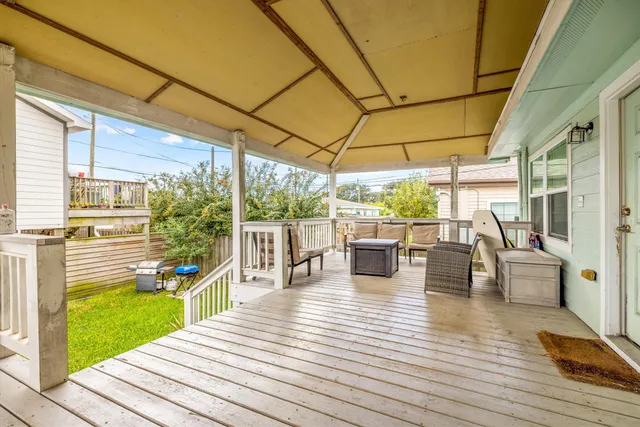 a view of a patio with dining table and chairs