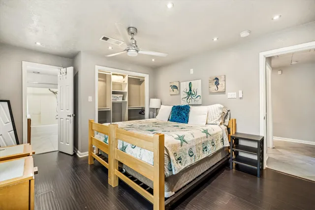 a bed room with a bed and a chandelier