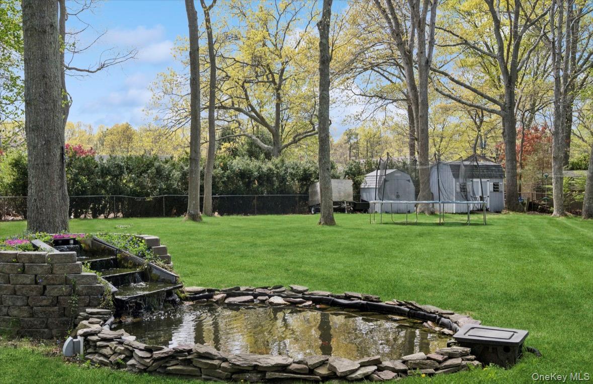 85 Old Stone Road Calverton, NY 11933 - Photo 12 of 19 a view of a garden with an outdoor space