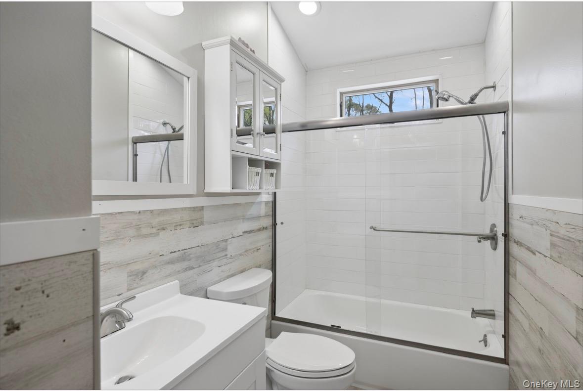 85 Old Stone Road Calverton, NY 11933 - Photo 4 of 19 a bathroom with a shower a toilet and a sink