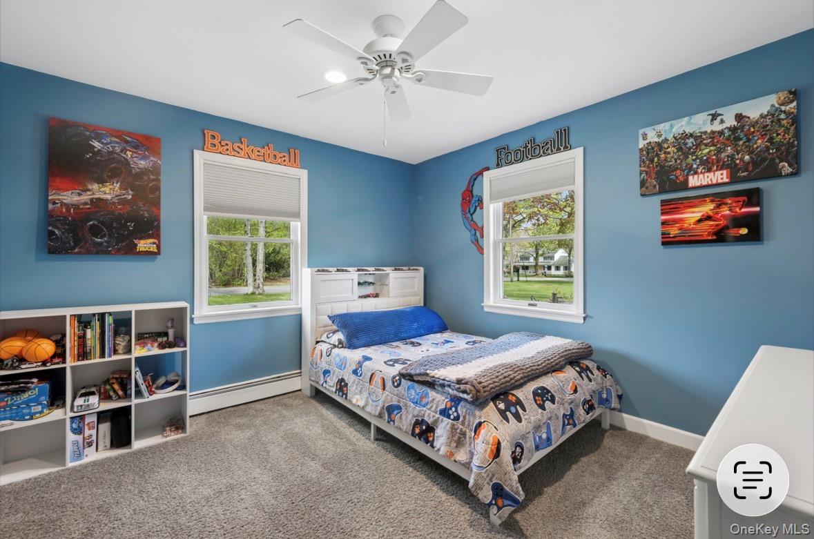 85 Old Stone Road Calverton, NY 11933 - Photo 7 of 19 a bedroom with a bed and a window