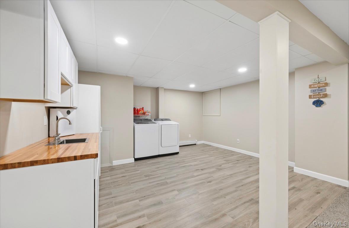 85 Old Stone Road Calverton, NY 11933 - Photo 10 of 19 a view of a kitchen with wooden floor and electronic appliances