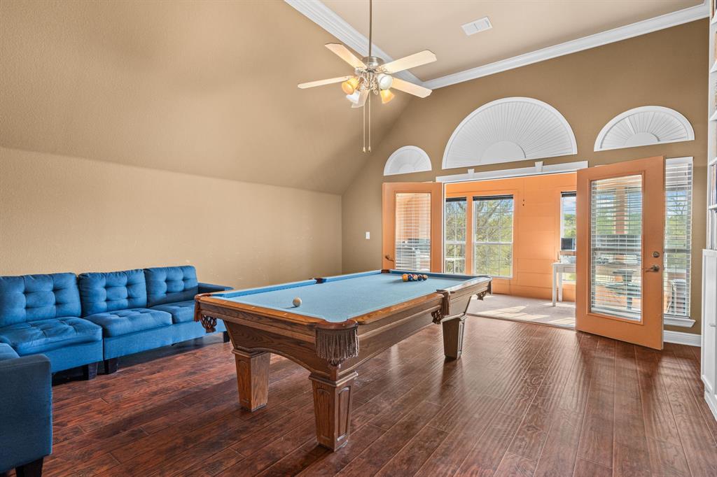 112 Waterfall Court Azle, TX 76020 - Photo 26 of 40 a room with furniture and wooden floor