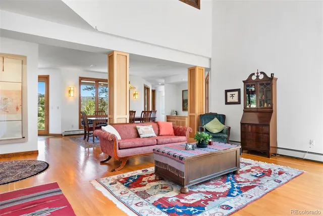 a living room with furniture and a rug