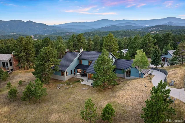 a view of houses with outdoor space and garden