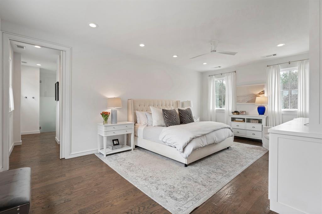 6605 Robin Road Dallas, TX 75209 - Photo 13 of 28 a spacious bedroom with a bed and a couch