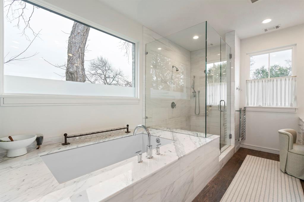 6605 Robin Road Dallas, TX 75209 - Photo 15 of 28 a bathroom with a bathtub and a shower