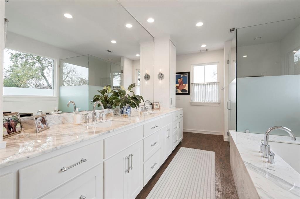 6605 Robin Road Dallas, TX 75209 - Photo 16 of 28 a bathroom with a double vanity sink and a mirror