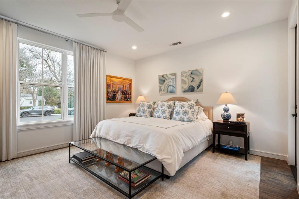 6605 Robin Road Dallas, TX 75209 - Photo 17 of 28 a bedroom with a bed chair and window