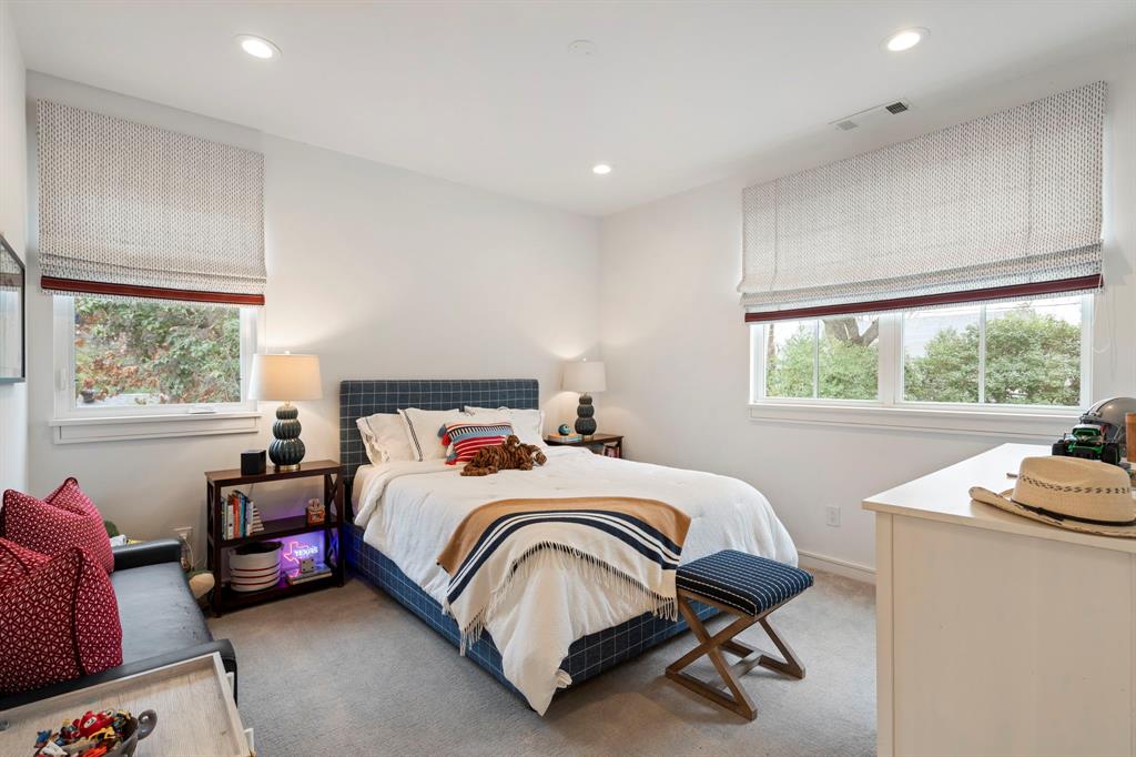 6605 Robin Road Dallas, TX 75209 - Photo 19 of 28 a bedroom with a bed chair and window