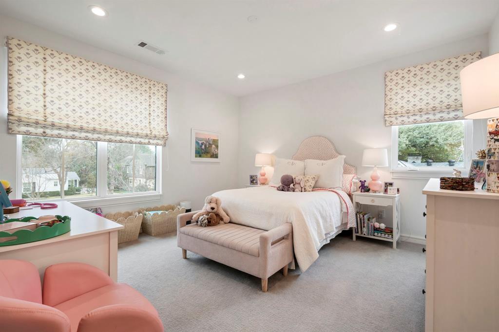6605 Robin Road Dallas, TX 75209 - Photo 21 of 28 a bedroom with bed and a large window