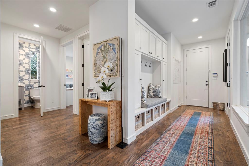 6605 Robin Road Dallas, TX 75209 - Photo 24 of 28 a view of a hallway with wooden floor and furniture