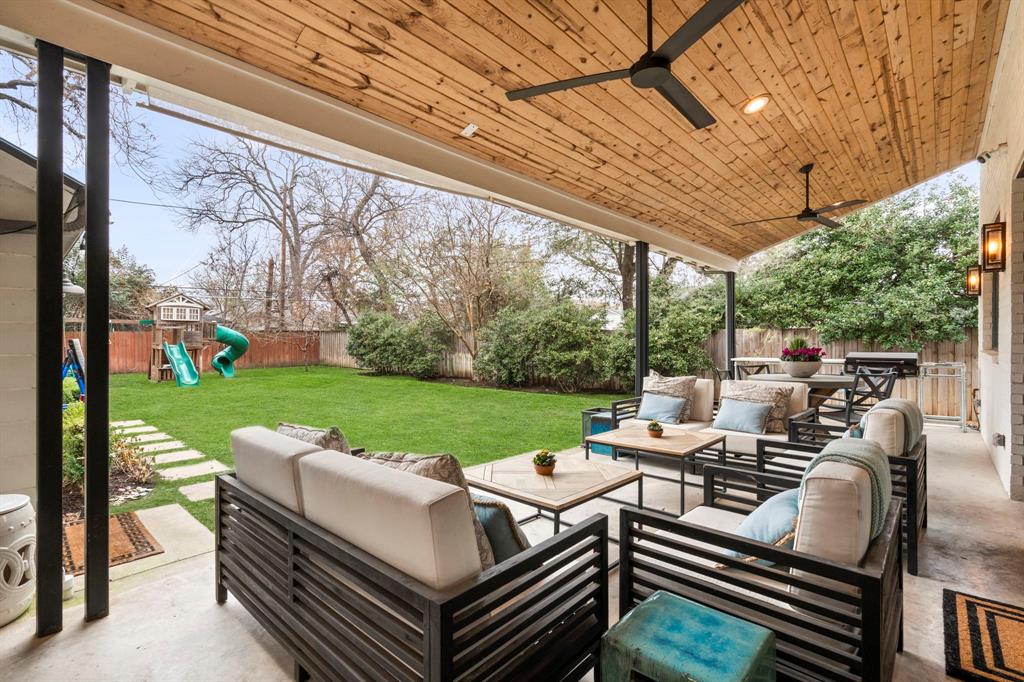 6605 Robin Road Dallas, TX 75209 - Photo 25 of 28 a view of a patio with couches chairs and a big yard