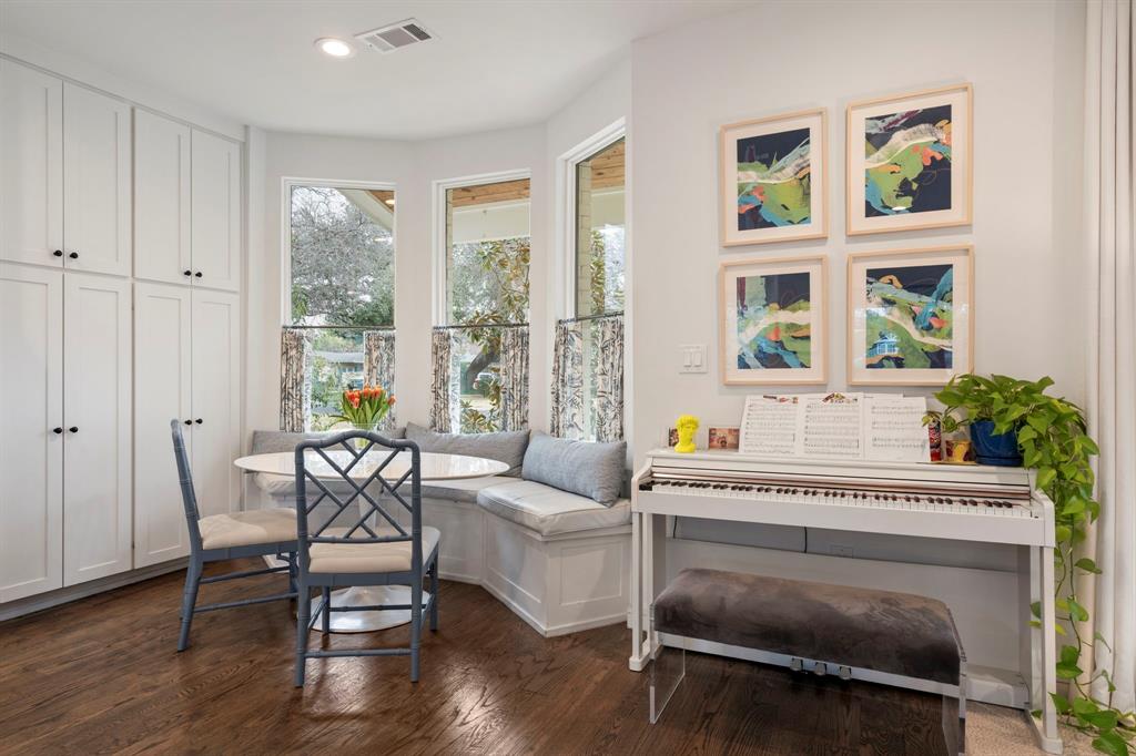 6605 Robin Road Dallas, TX 75209 - Photo 10 of 28 a living room with furniture and a potted plant next to a window