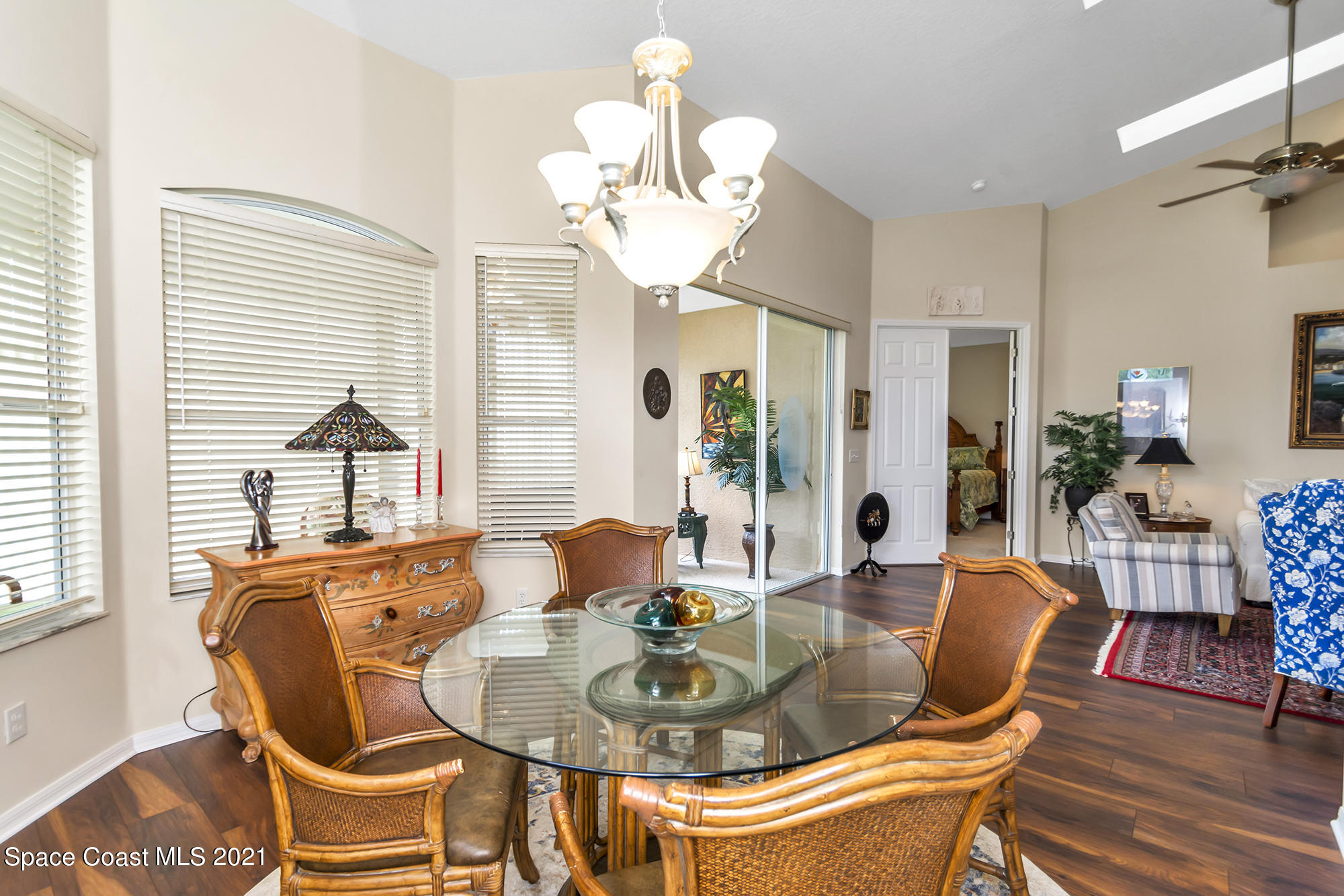 569 Renaissance Avenue Melbourne, FL 32940 - Photo 13 of 34 a dining room with furniture and wooden floor