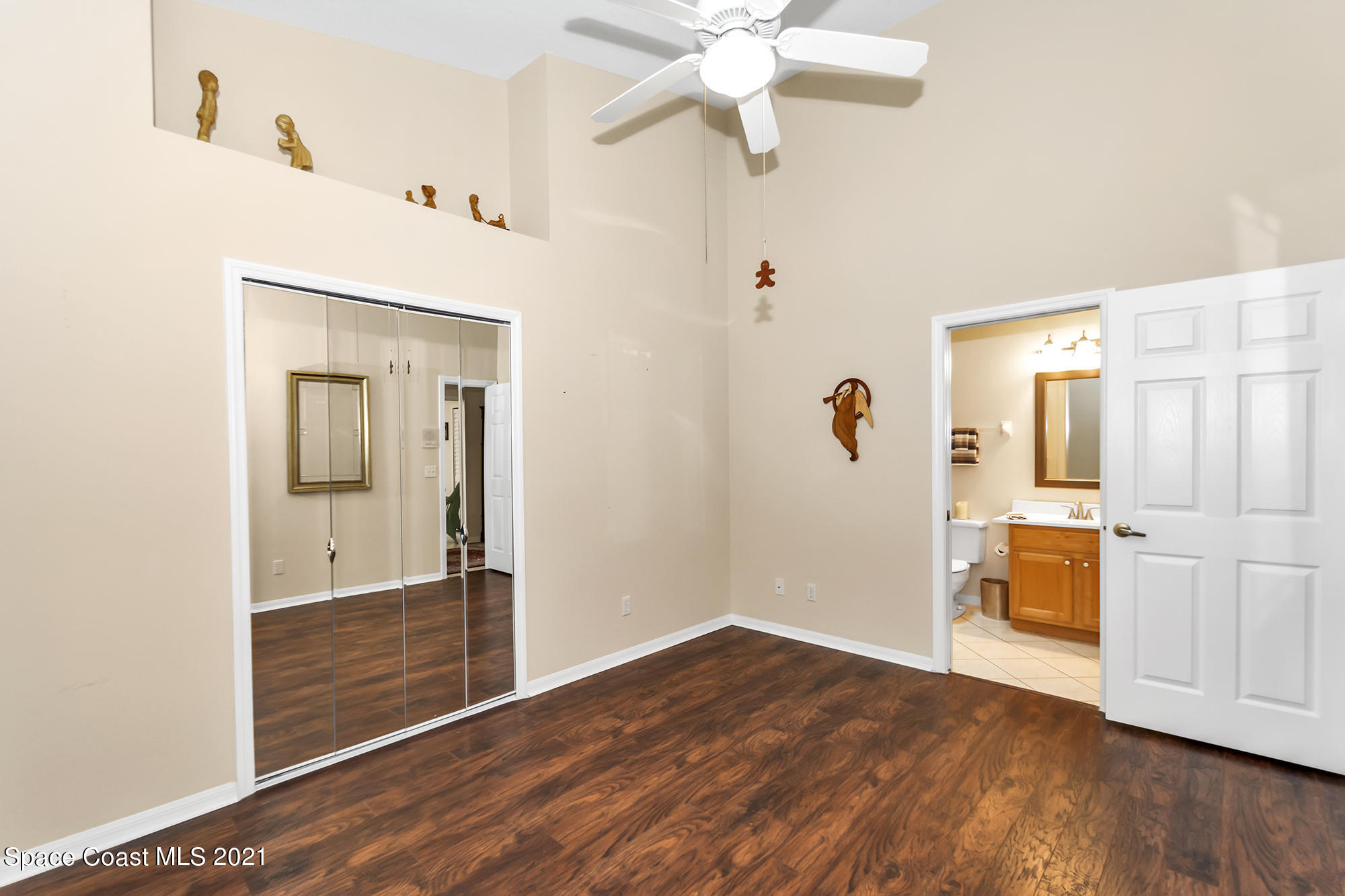 569 Renaissance Avenue Melbourne, FL 32940 - Photo 23 of 34 a view of a hallway with wooden floor and closet