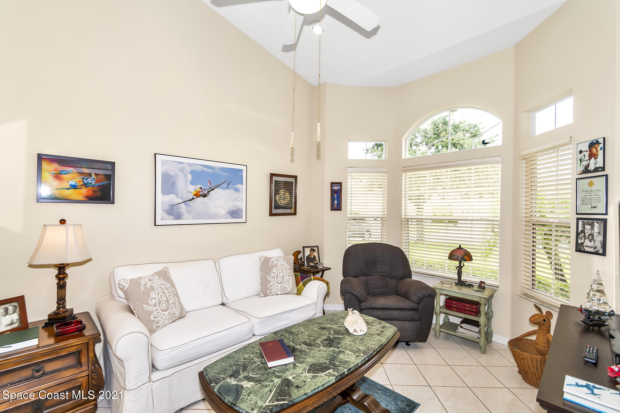 569 Renaissance Avenue Melbourne, FL 32940 - Photo 24 of 34 a living room with furniture and a large window