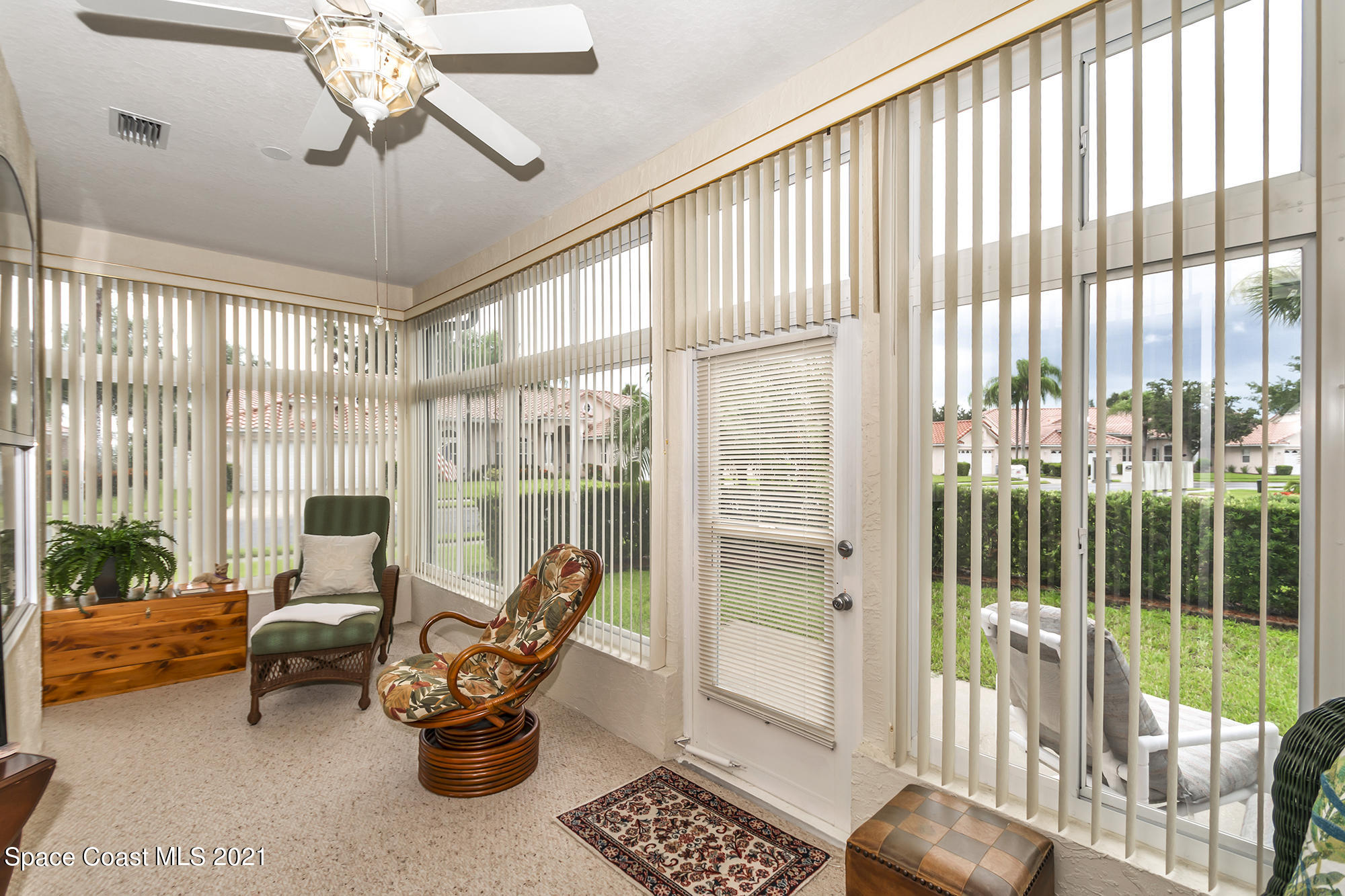 569 Renaissance Avenue Melbourne, FL 32940 - Photo 28 of 34 a living room filled with furniture and a large window